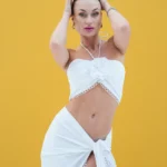 Skirt with tie and short shirt adorned with flowers